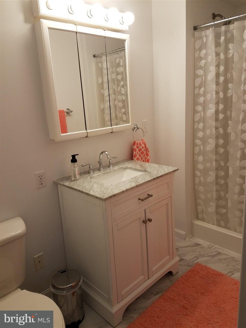 2105 Copenhaffer Road Dover, PA 17315 - Photo 25 of 36 a bathroom with a granite countertop sink toilet and shower