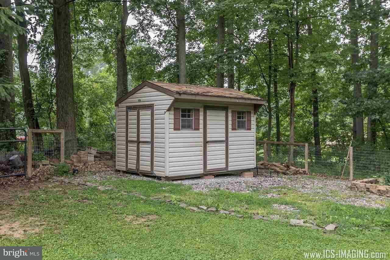 2105 Copenhaffer Road Dover, PA 17315 - Photo 35 of 36 a view of a house with a yard and large trees