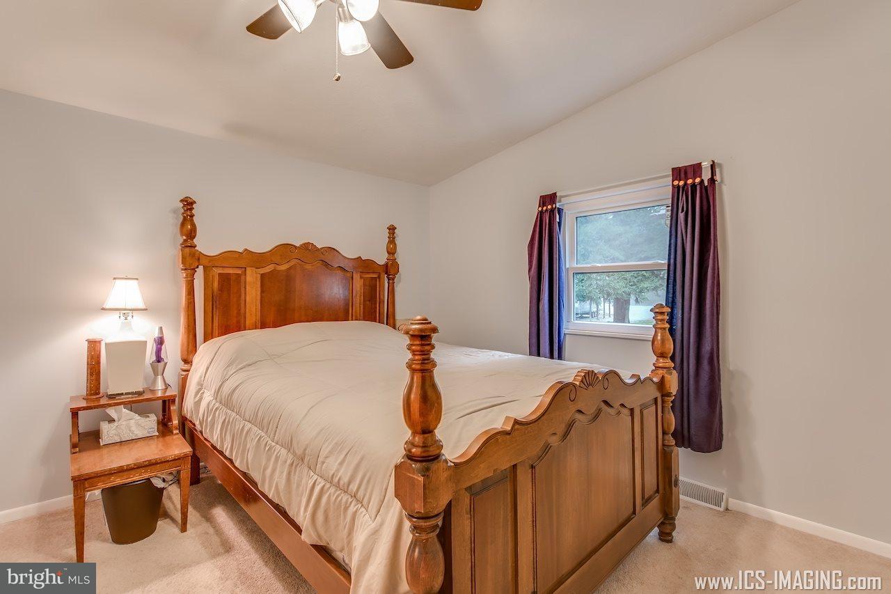 2105 Copenhaffer Road Dover, PA 17315 - Photo 10 of 36 a large bed sitting in a bedroom next to a window