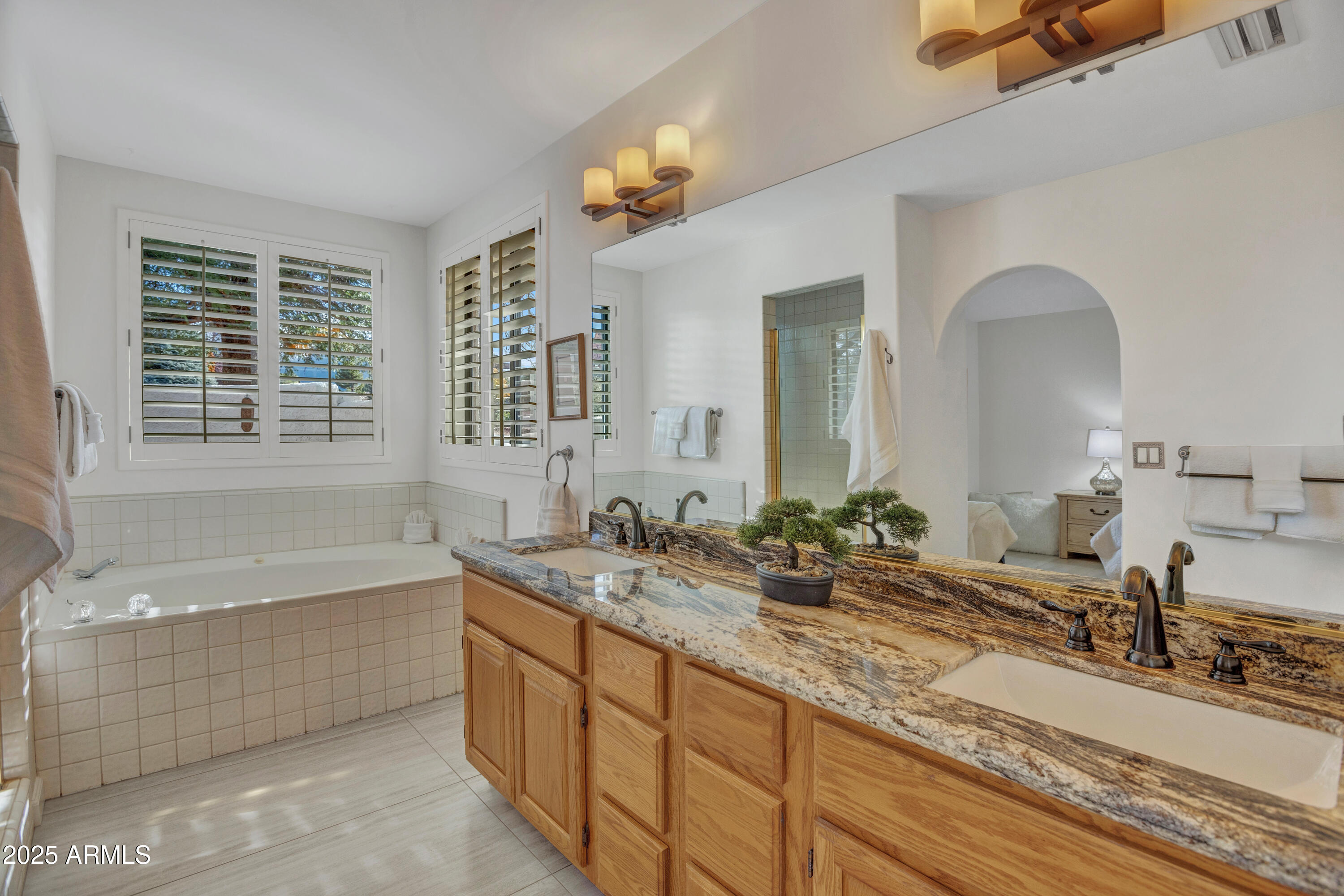 375 Indian Cliffs Road Sedona, AZ 86336 - Photo 14 of 28 a spacious bathroom with sinks mirror and a bathtub