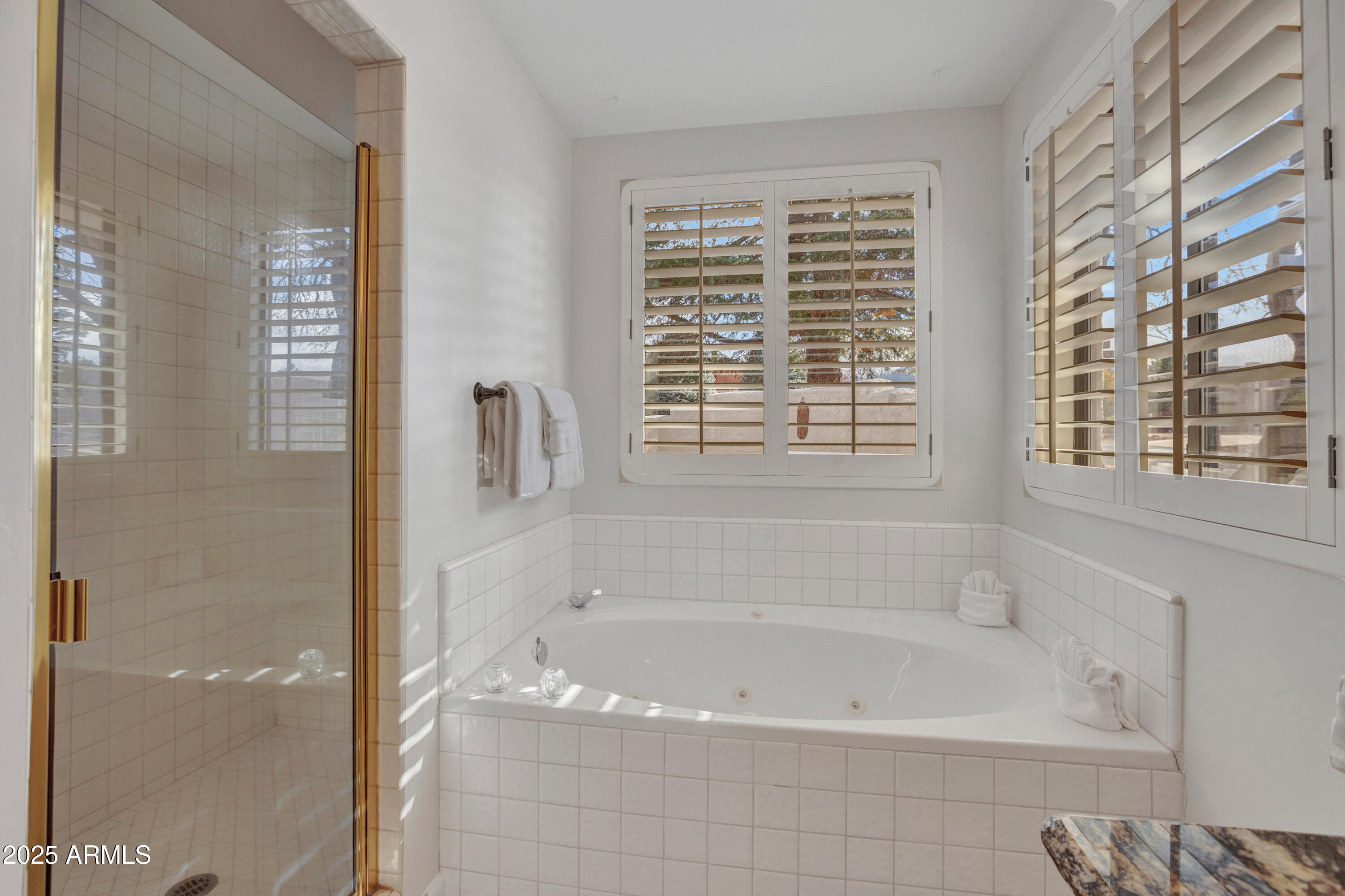 375 Indian Cliffs Road Sedona, AZ 86336 - Photo 15 of 28 a bath tub sitting next to a window