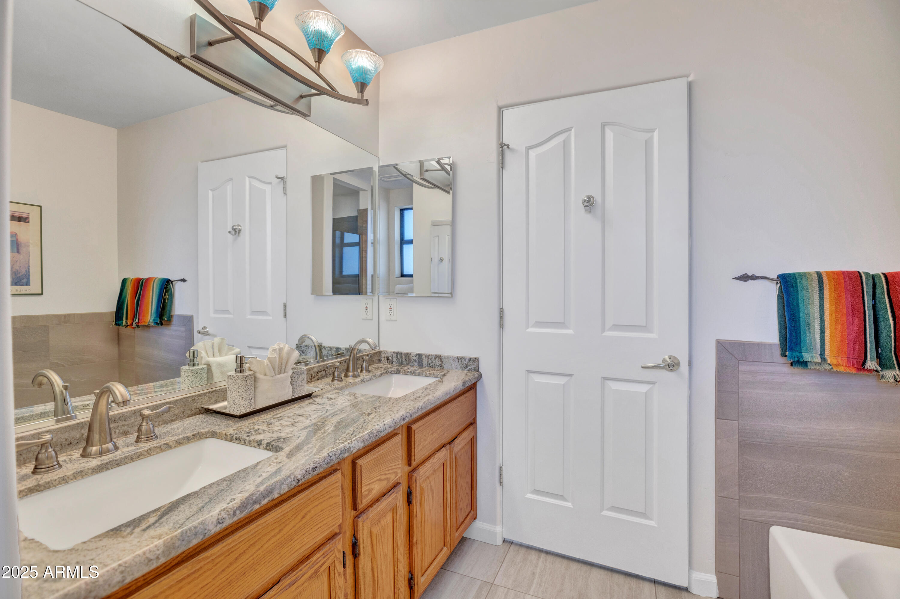 375 Indian Cliffs Road Sedona, AZ 86336 - Photo 17 of 28 a bathroom with double vanity sinks and a mirror