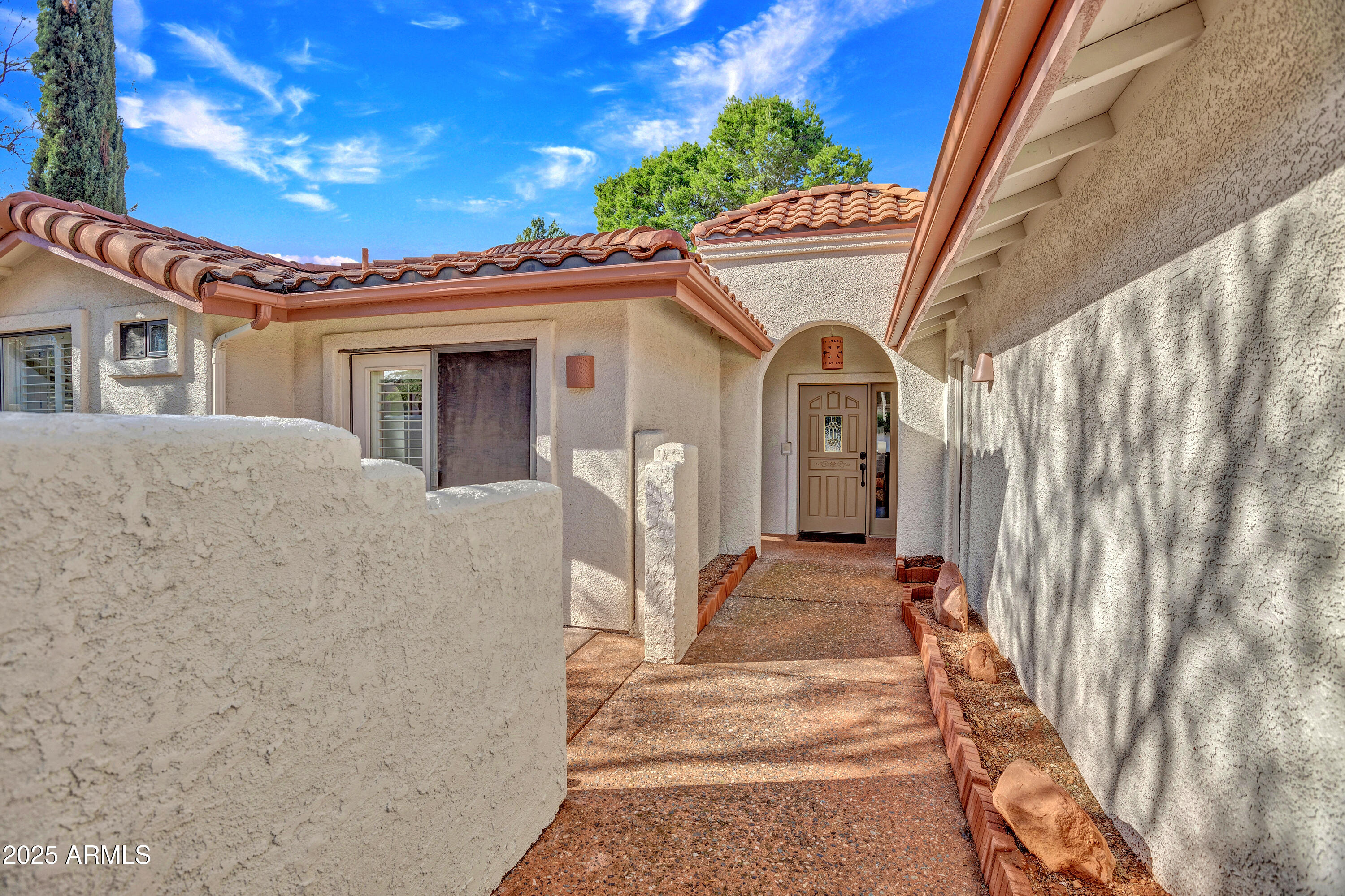 375 Indian Cliffs Road Sedona, AZ 86336 - Photo 23 of 28 a front view of a house with a outdoor space