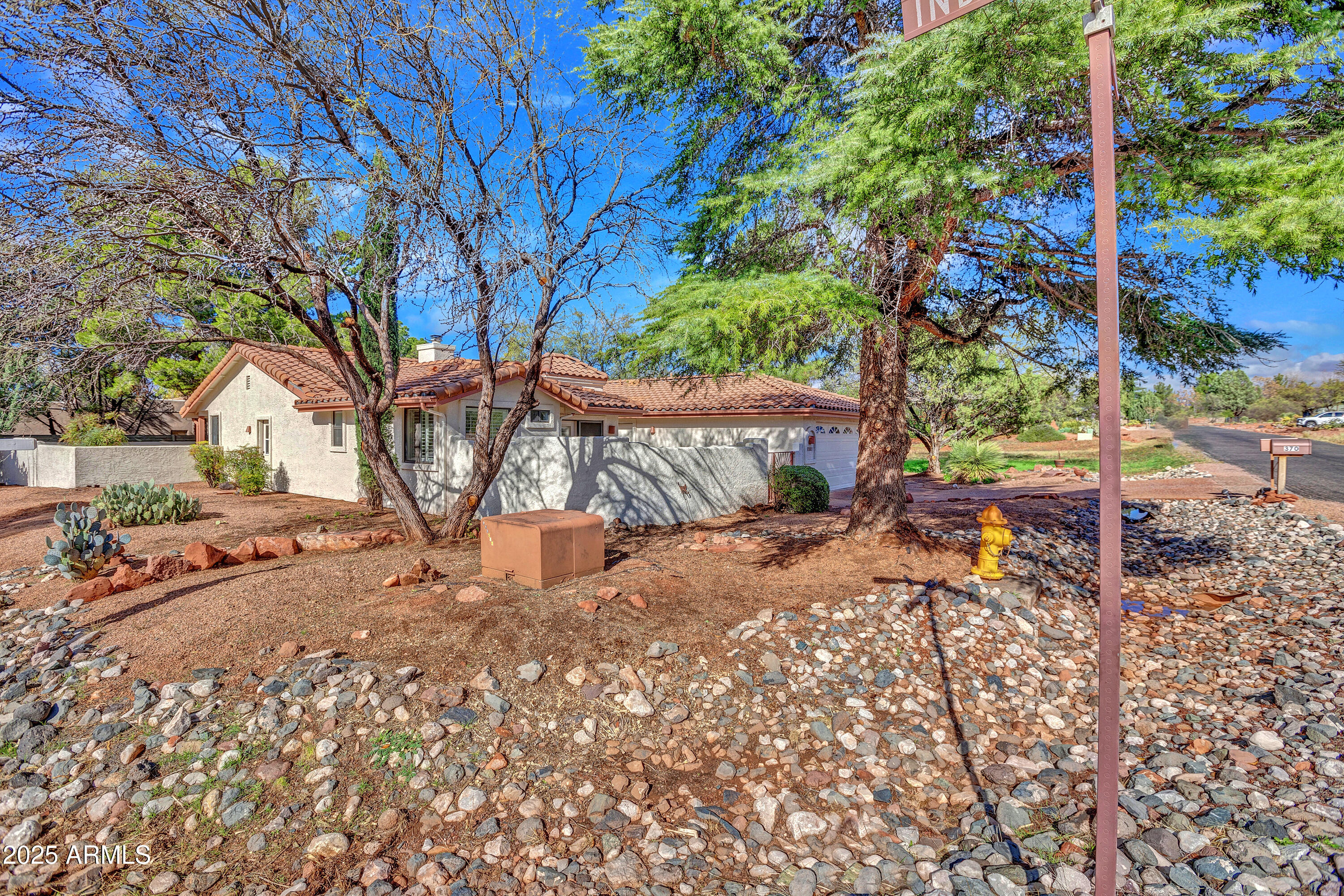 375 Indian Cliffs Road Sedona, AZ 86336 - Photo 24 of 28 a view of a yard with large tree