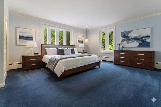 a living room with furniture a window and a flat screen tv