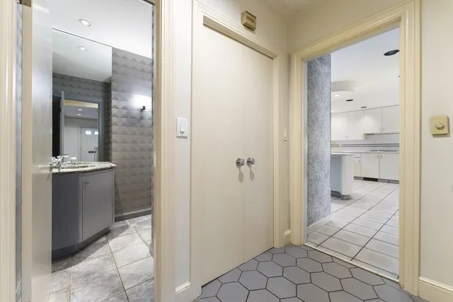 a view of a hallway view with wooden floor and staircase