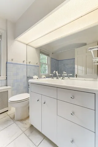 a view of an empty room with empty shelves