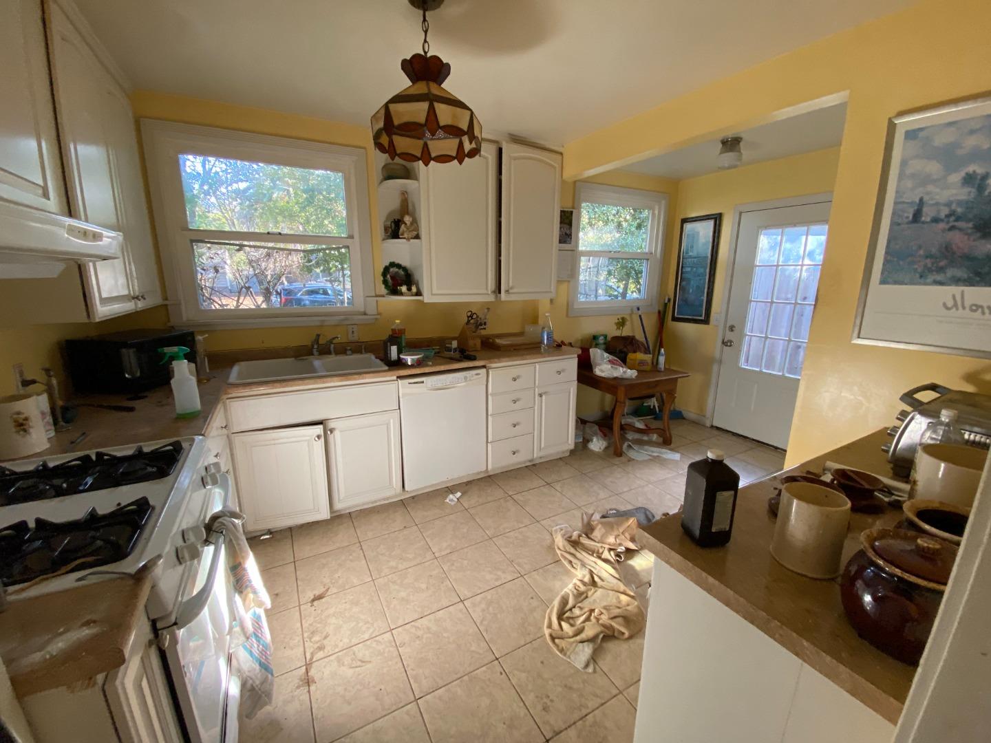 811 Fifteenth Avenue Menlo Park, CA 94025 - Photo 10 of 18 a kitchen with a sink appliances and cabinets