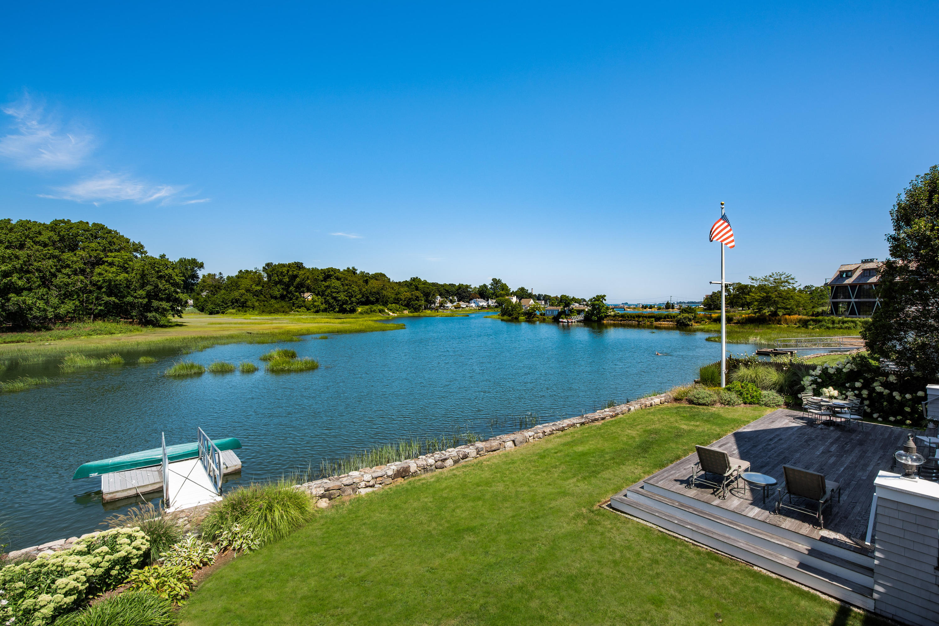18 Pine Point Road Rowayton, CT 06853 - Photo 21 of 37 a view of a lake with a big yard