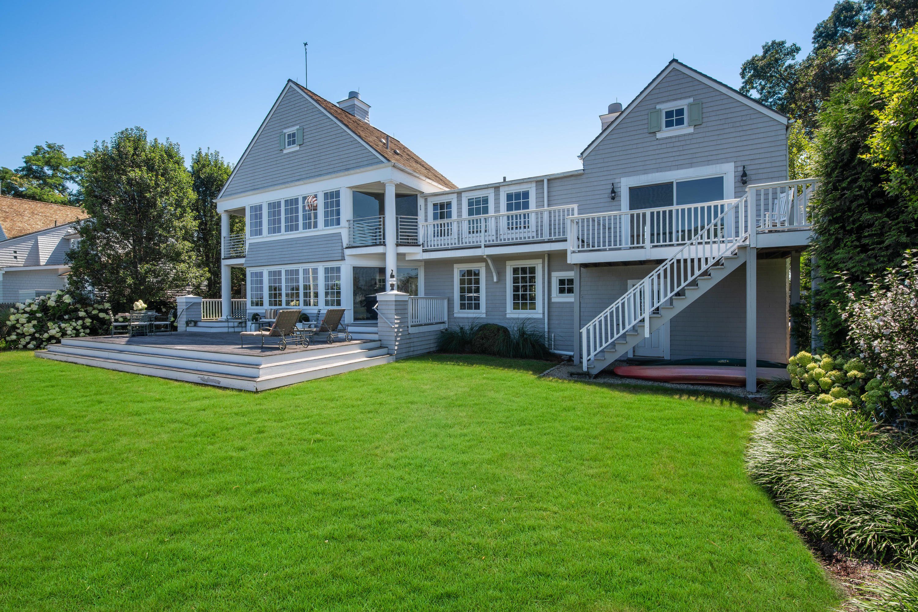 18 Pine Point Road Rowayton, CT 06853 - Photo 23 of 37 a front view of a house with garden and sitting area