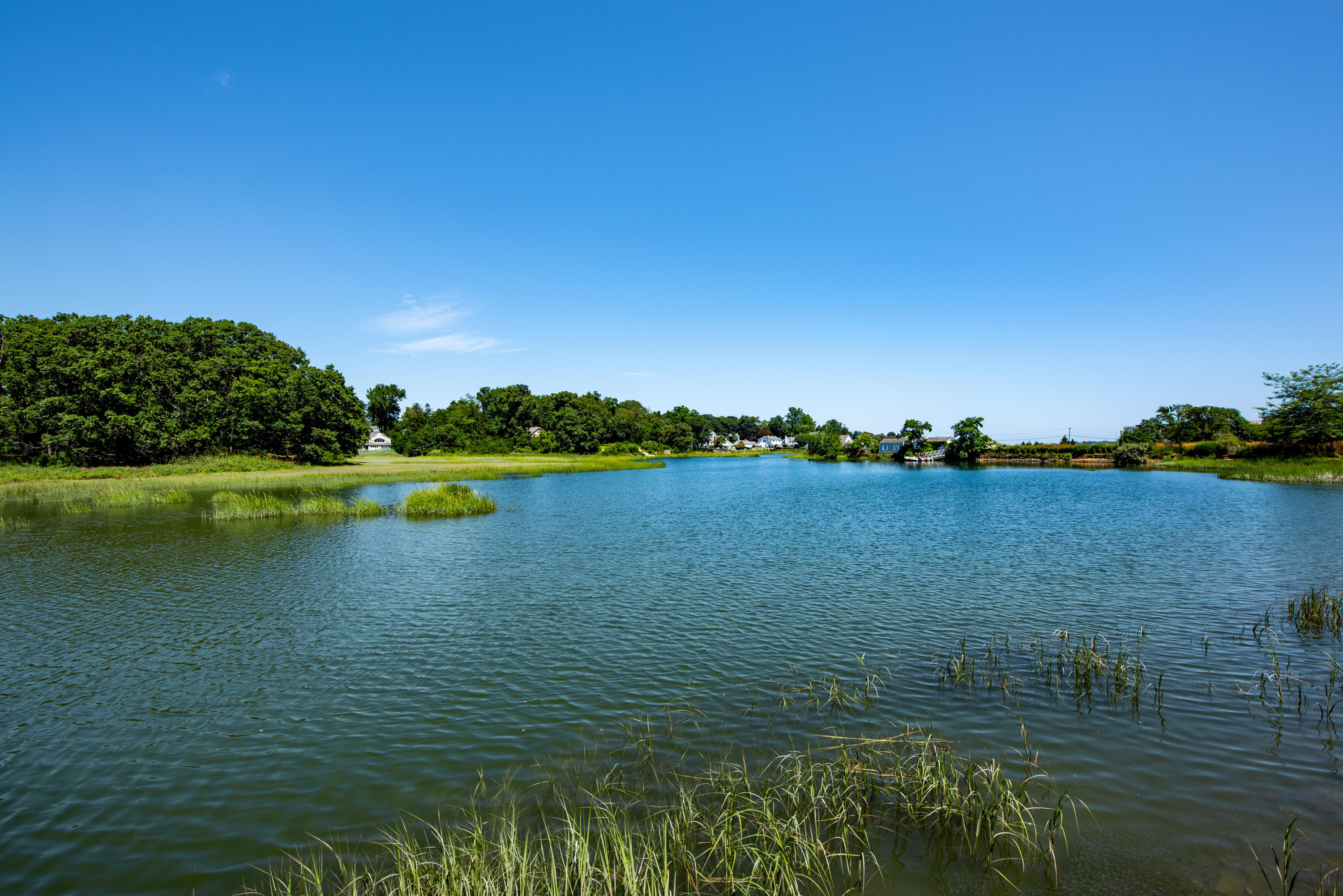 18 Pine Point Road Rowayton, CT 06853 - Photo 27 of 37 a view of a lake with houses in the background