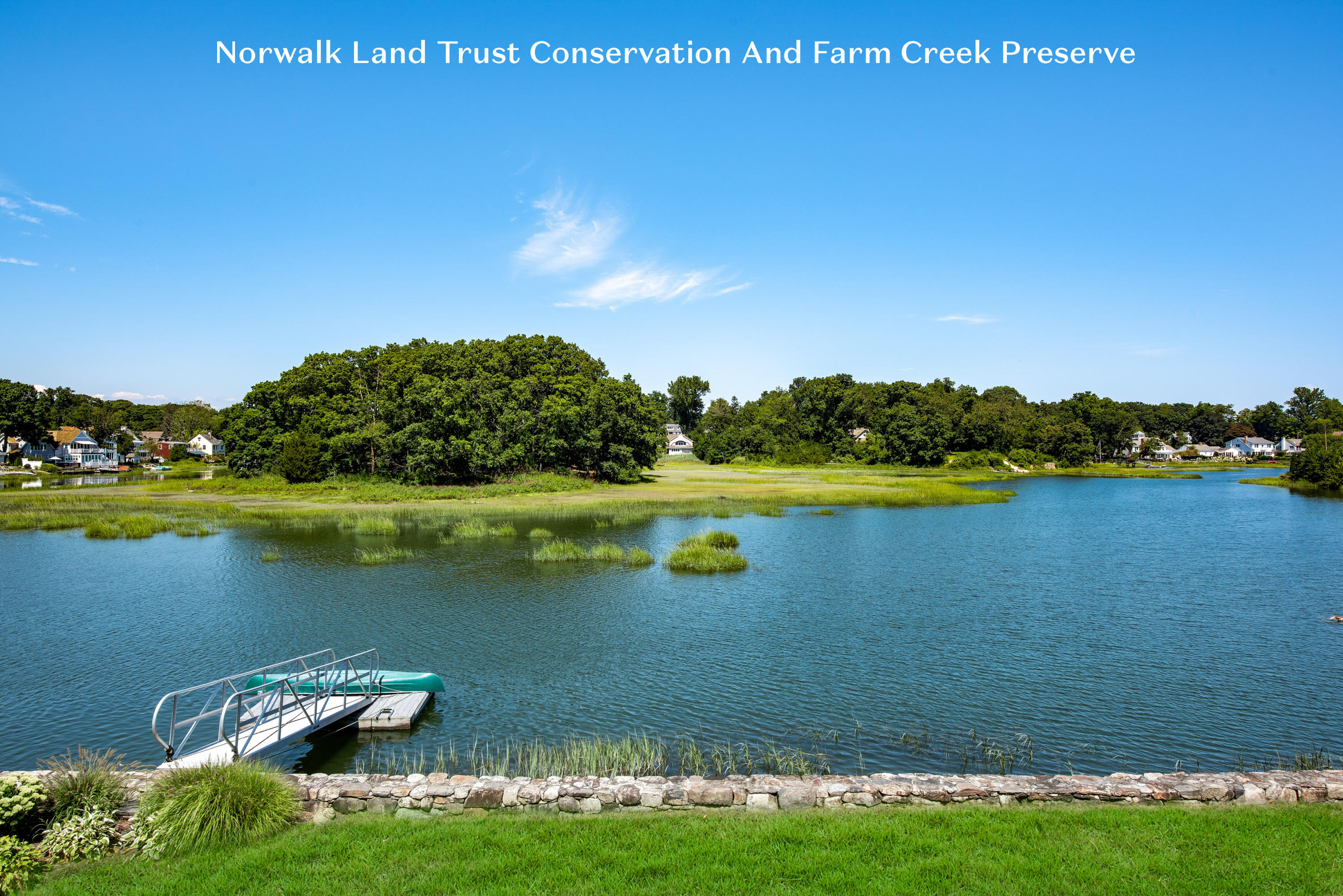 18 Pine Point Road Rowayton, CT 06853 - Photo 3 of 37 a view of a lake with a house in the background