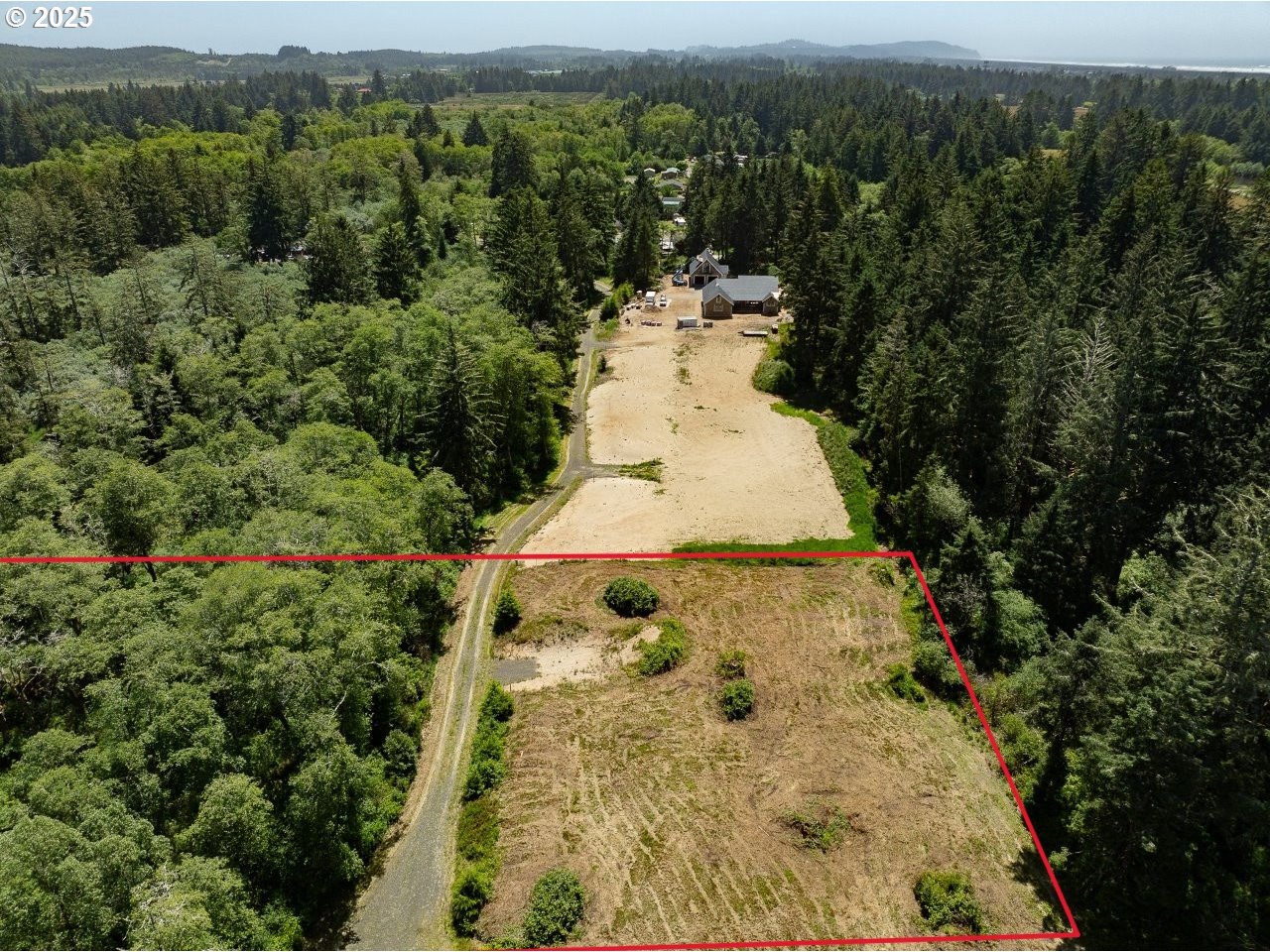 10501 Pearl Lane Long Beach, WA 98631 - Photo 9 of 9 an aerial view of a house with a yard