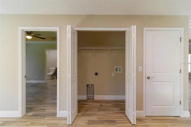 a view of a bathroom with wooden door