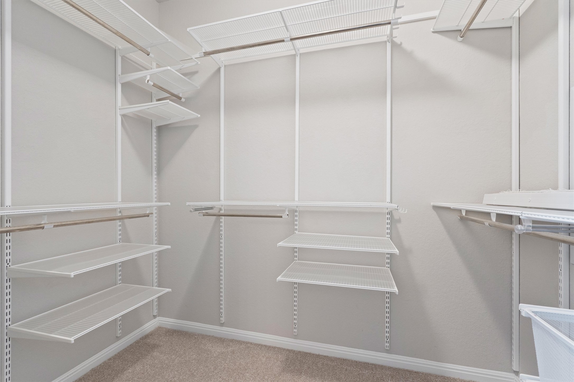 10817 Gonzales Ranger Pass Austin, TX 78754 - Photo 17 of 37 You won't run out of storage space here! This walk-in closet comes fully equipped with a custom Elfa closet system from the container store.