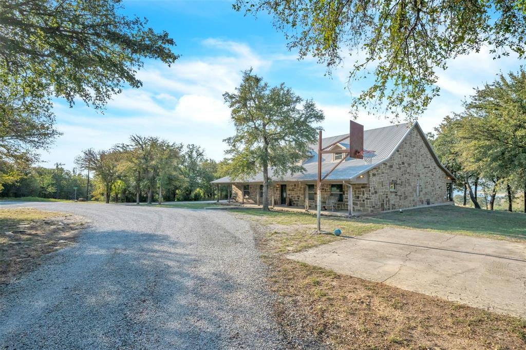 139 Pr-1537 Road Bridgeport, TX 76426 - Photo 18 of 40 a house with trees in the background