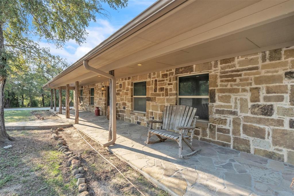139 Pr-1537 Road Bridgeport, TX 76426 - Photo 19 of 40 a view of a patio with table and chairs near a barn