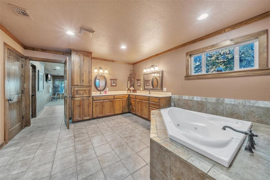139 Pr-1537 Road Bridgeport, TX 76426 - Photo 32 of 40 a large white kitchen with a sink and cabinets