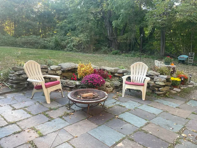 a view of a lounge chair and table on the terrace