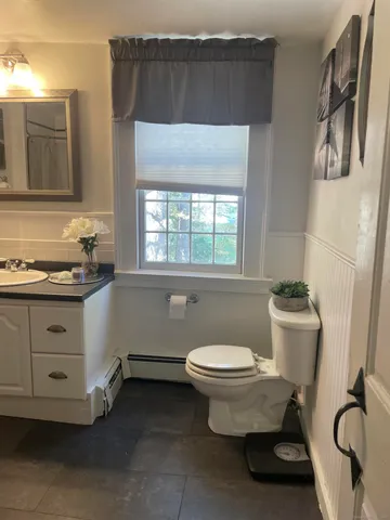 a bathroom with a toilet and a sink
