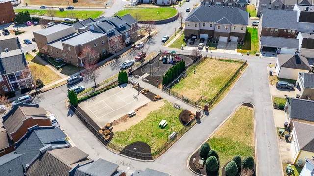 an aerial view of a house with a swimming pool