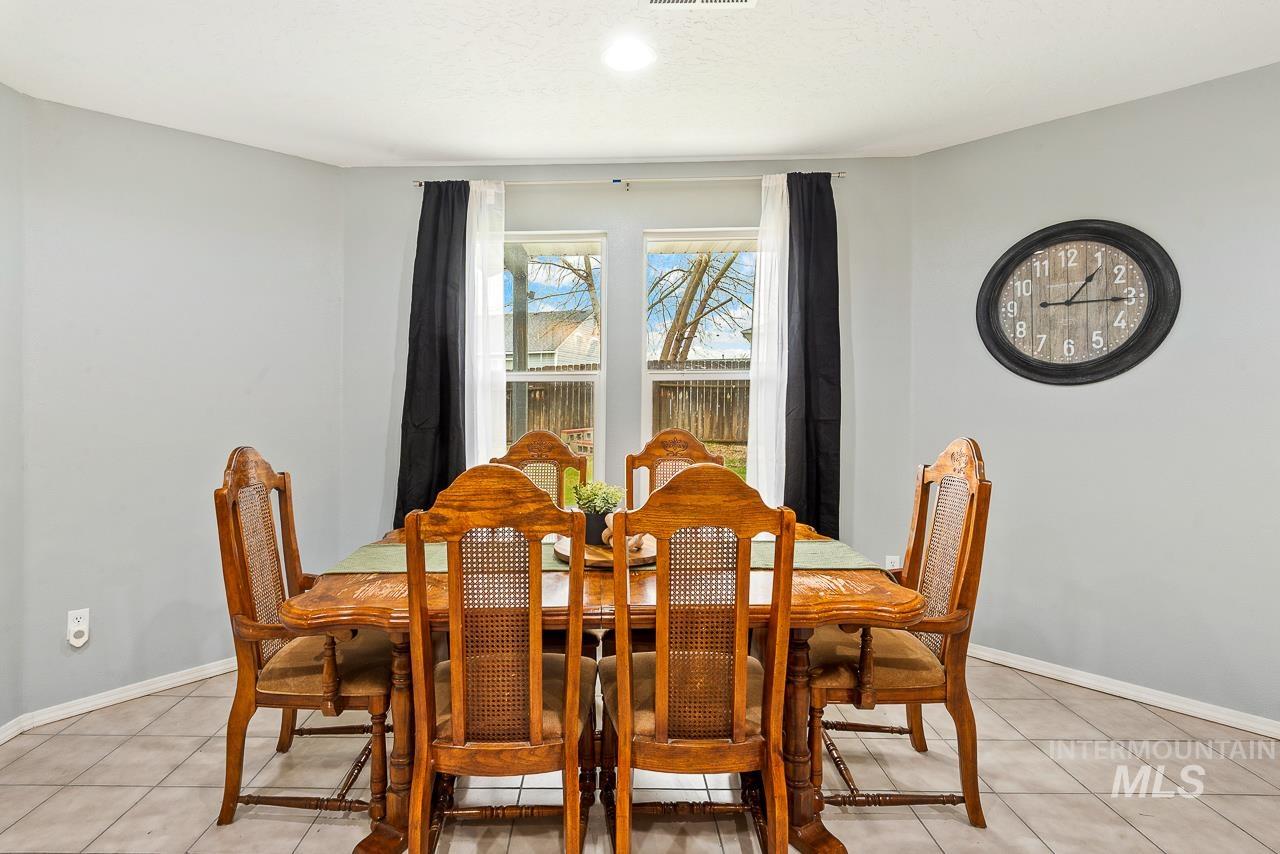 16290 Jewel Way Caldwell, ID 83607 - Photo 13 of 36 Dining space featuring light tile patterned floors