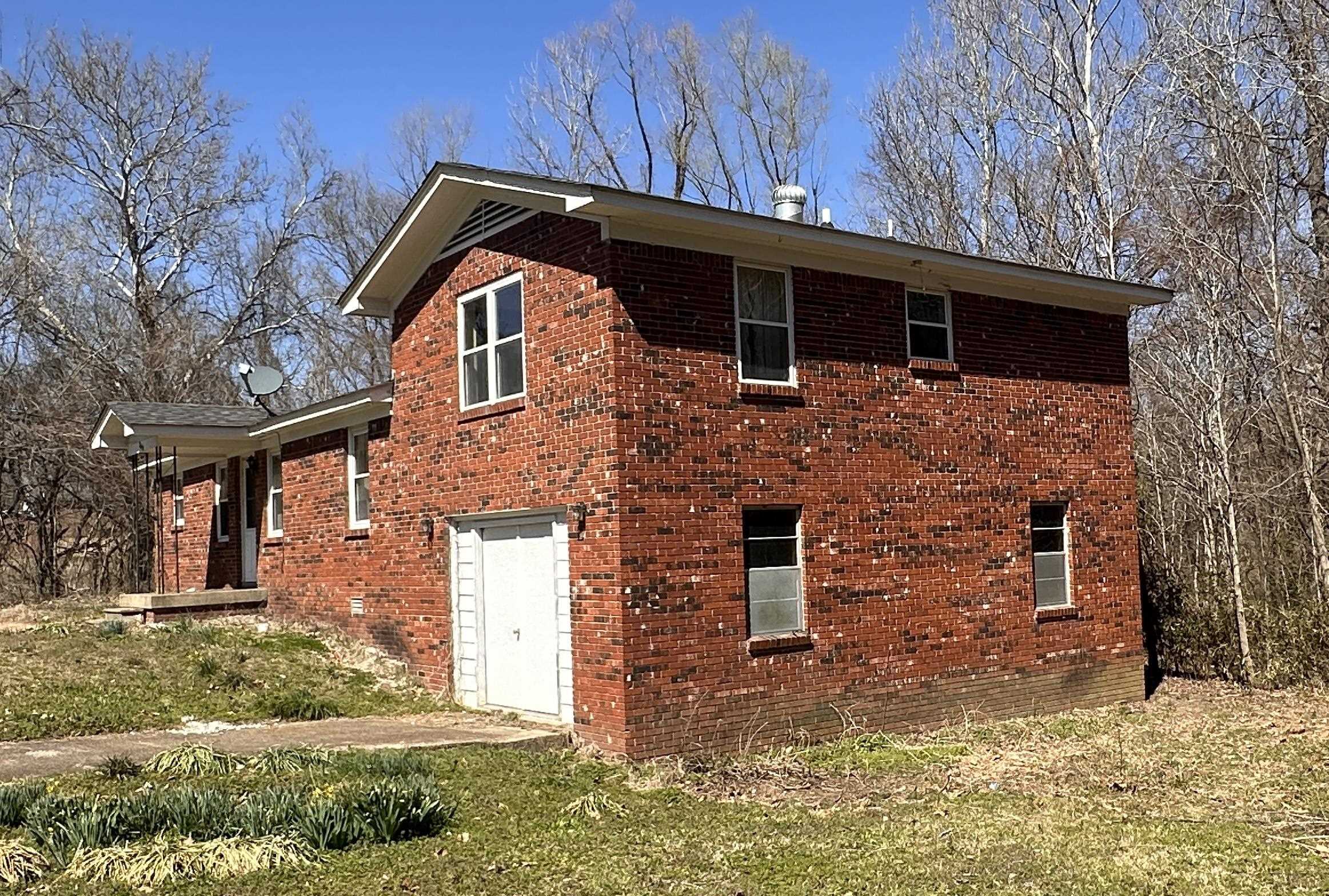 9640 New Bethel Road Millington, TN 38053 - Photo 3 of 22 a front view of a house with a yard