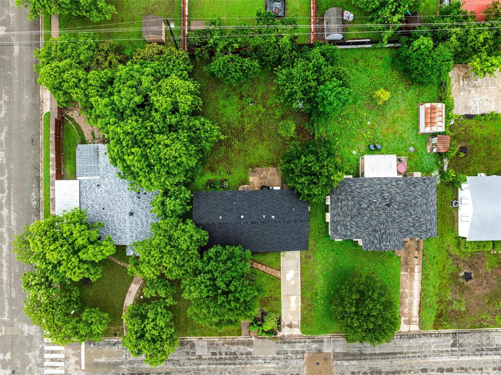 3904 North 21st A Street Waco, TX 76708 - Photo 25 of 26 Aerial view showcasing a residential property with a dark shingle roof and a light shingle roof structure