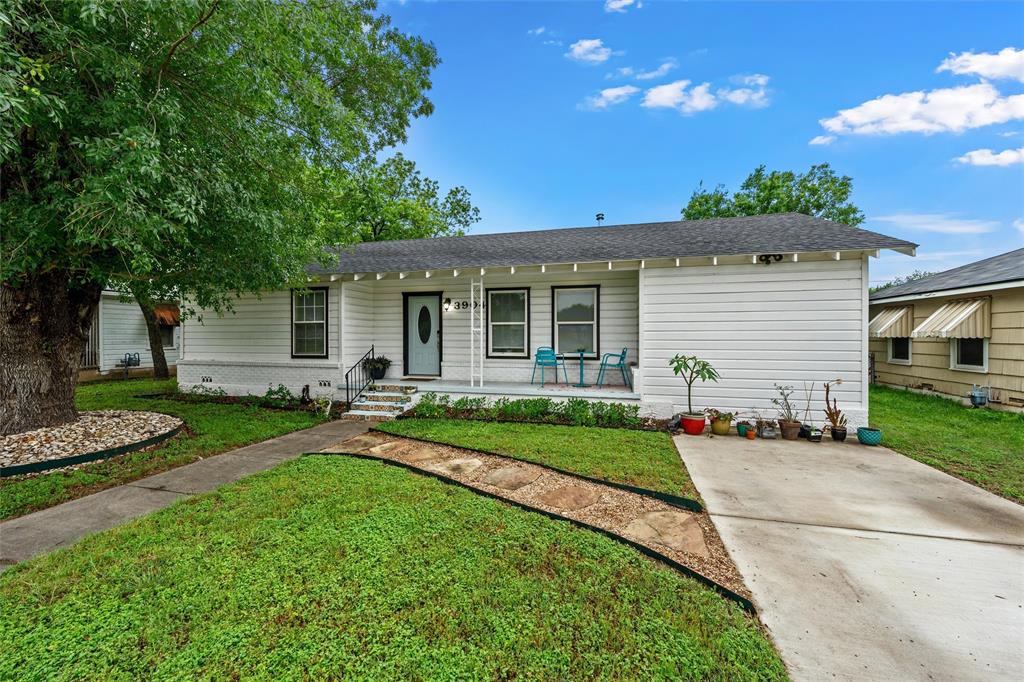 3904 North 21st A Street Waco, TX 76708 - Photo 3 of 26 White siding exterior with a light blue entry door