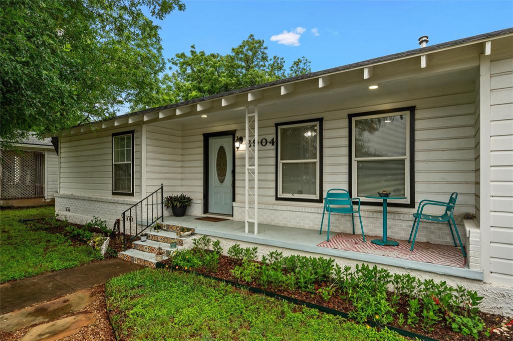 3904 North 21st A Street Waco, TX 76708 - Photo 6 of 26 Single-story residence featuring white horizontal siding and dark trim windows