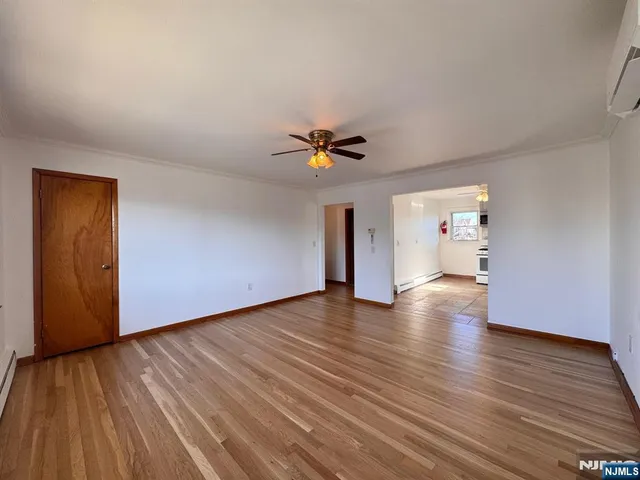 a kitchen with a refrigerator a microwave a stove and cabinets