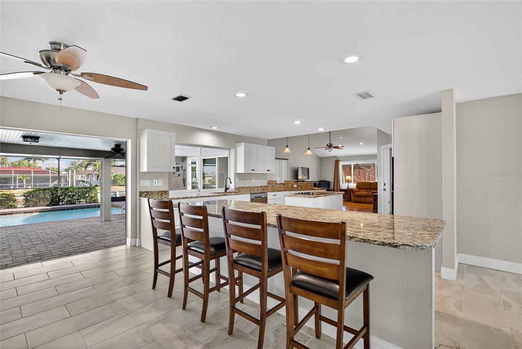 926 Genoa Court Punta Gorda, FL 33950 - Photo 11 of 41 a dining hall with stainless steel appliances granite countertop a dining table and chairs
