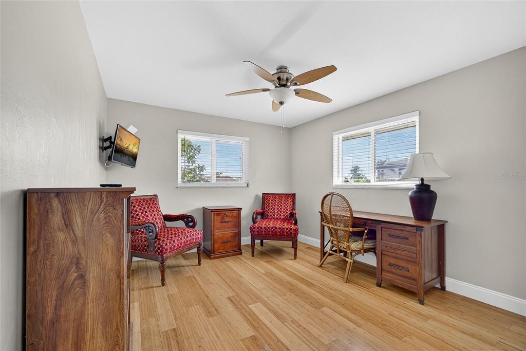 926 Genoa Court Punta Gorda, FL 33950 - Photo 20 of 41 a workspace with wooden floor and furniture