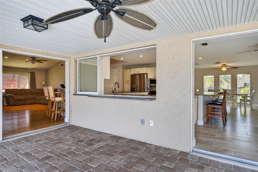 926 Genoa Court Punta Gorda, FL 33950 - Photo 23 of 41 a view of a hallway with a dining table and chairs