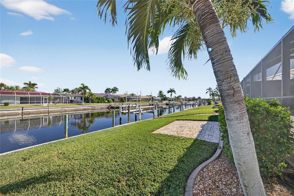 926 Genoa Court Punta Gorda, FL 33950 - Photo 30 of 41 a view of a lake with a palm trees