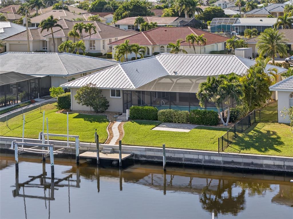 926 Genoa Court Punta Gorda, FL 33950 - Photo 33 of 41 a view of a swimming pool with a lounge chairs