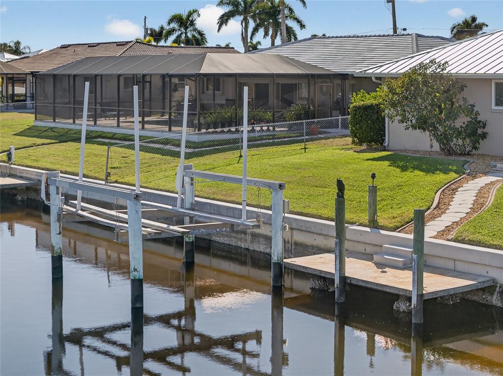 926 Genoa Court Punta Gorda, FL 33950 - Photo 34 of 41 a view of a house with swimming pool and porch with furniture