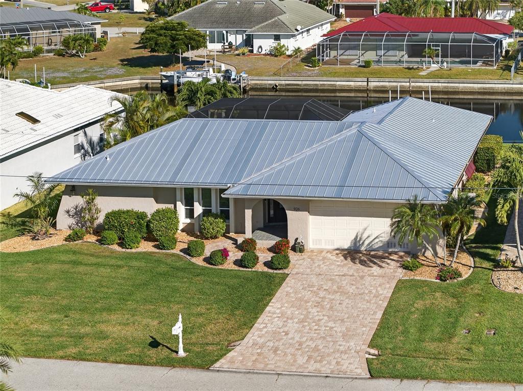 926 Genoa Court Punta Gorda, FL 33950 - Photo 39 of 41 a view of yard with table and chairs under an umbrella
