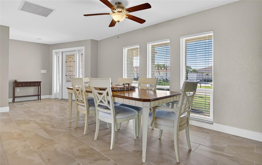 926 Genoa Court Punta Gorda, FL 33950 - Photo 5 of 41 a view of a dining room with furniture and window
