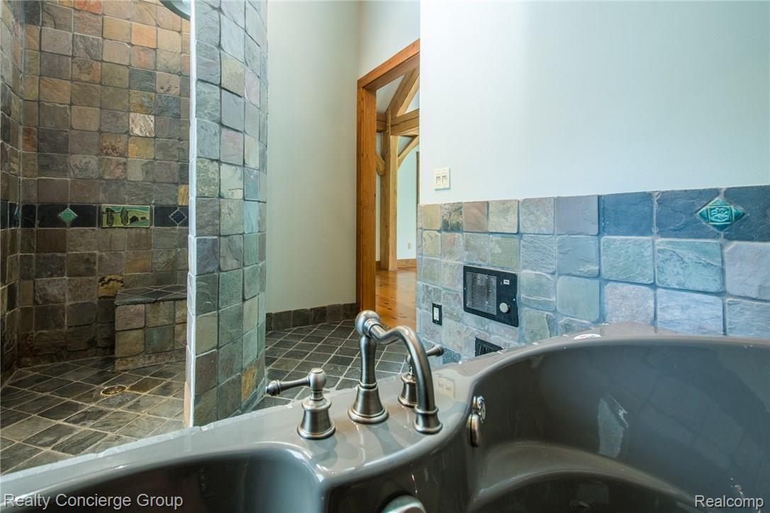 6022 Challis Road Brighton, MI 48116 - Photo 20 of 41 Check out the detail on the tile in the walk in Shower!