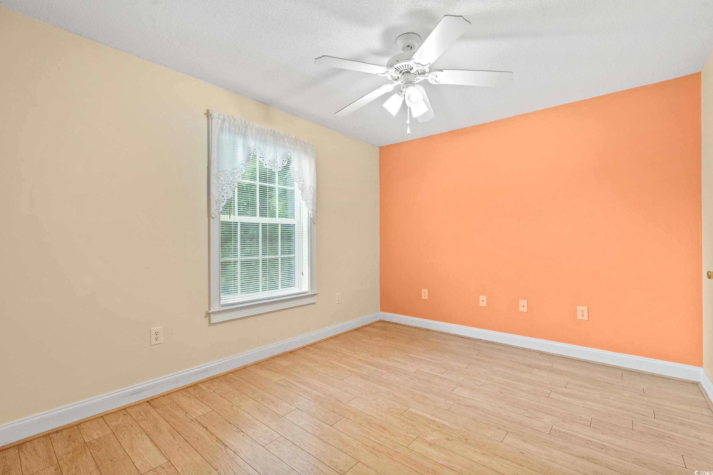 6016 Dick Pond Road, Unit 109 Myrtle Beach, SC 29588 - Photo 16 of 35 Spare room with baseboards, ceiling fan, and light