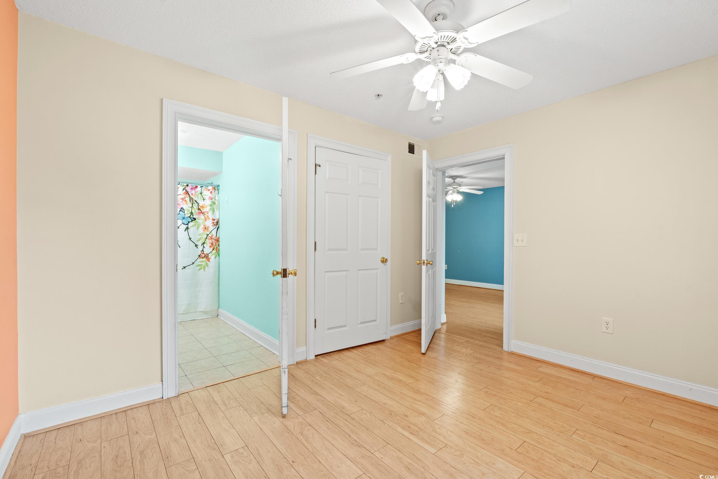 6016 Dick Pond Road, Unit 109 Myrtle Beach, SC 29588 - Photo 18 of 35 Unfurnished bedroom with light wood-style floors,
