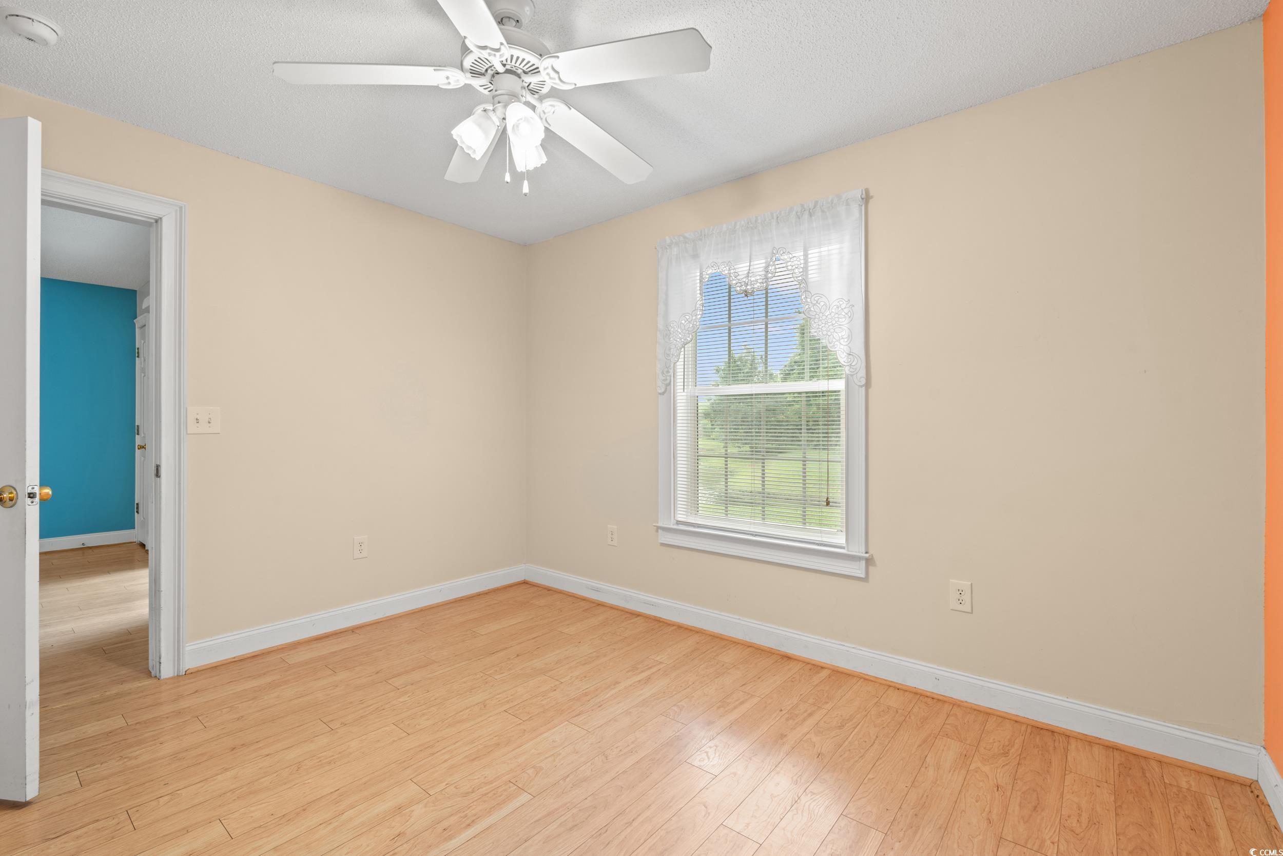 6016 Dick Pond Road, Unit 109 Myrtle Beach, SC 29588 - Photo 19 of 35 Spare room featuring baseboards, light wood-style