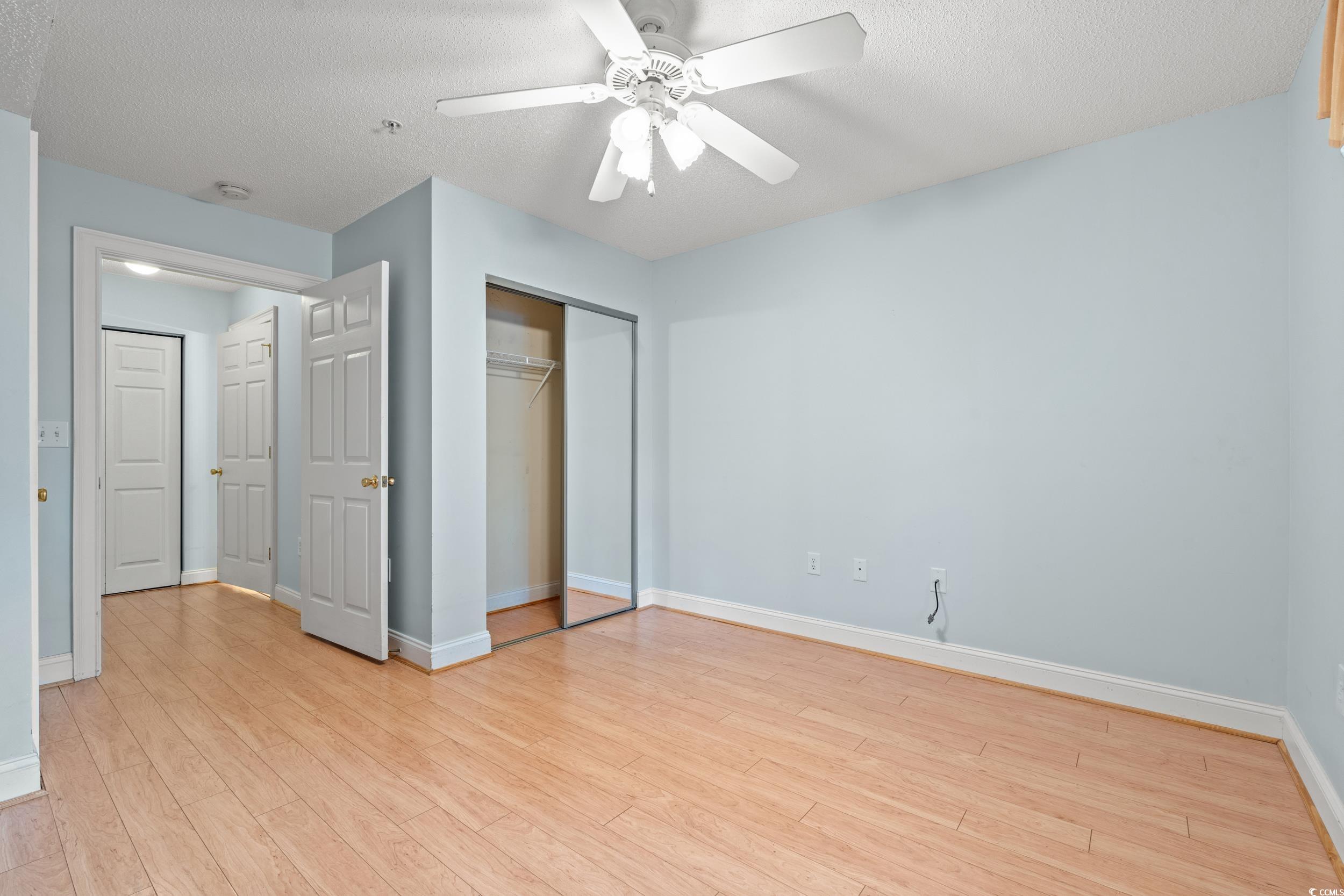 6016 Dick Pond Road, Unit 109 Myrtle Beach, SC 29588 - Photo 23 of 35 Unfurnished bedroom featuring light wood-style flo