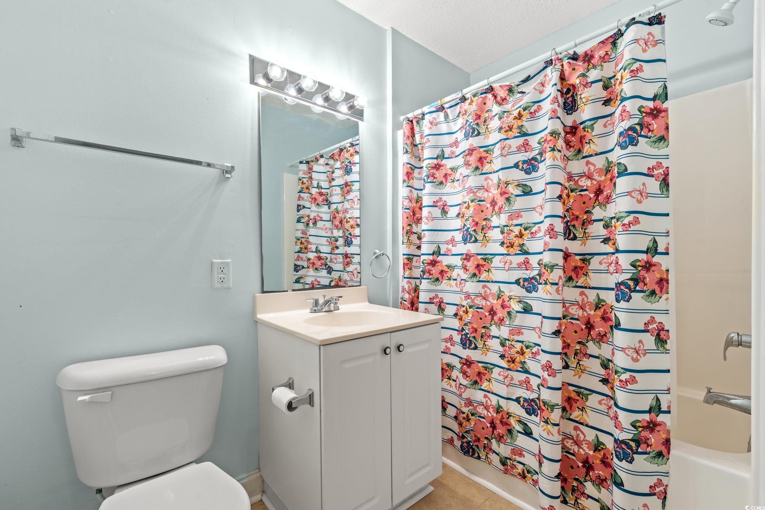 6016 Dick Pond Road, Unit 109 Myrtle Beach, SC 29588 - Photo 25 of 35 Full bath with vanity, shower / tub combo with cur
