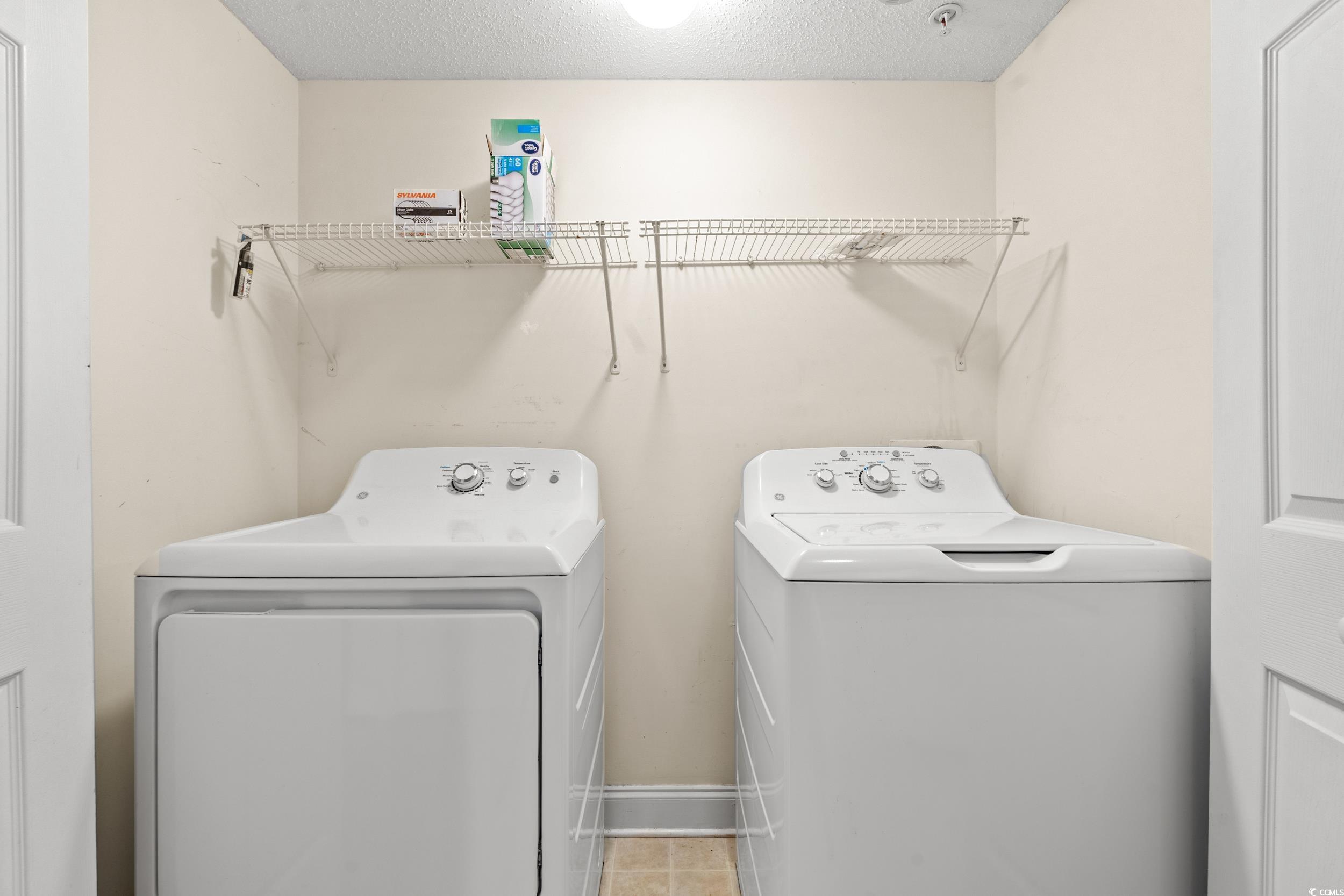 6016 Dick Pond Road, Unit 109 Myrtle Beach, SC 29588 - Photo 26 of 35 Laundry room featuring separate washer and dryer,