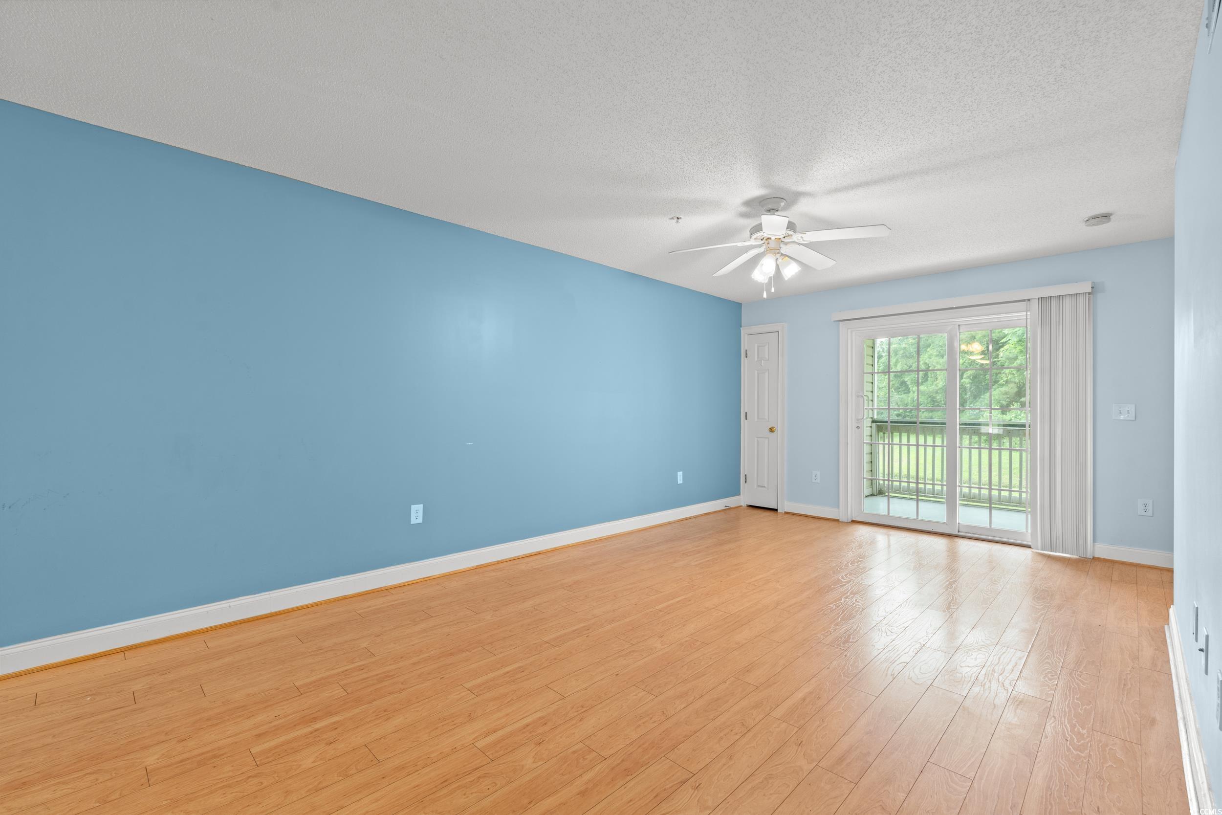 6016 Dick Pond Road, Unit 109 Myrtle Beach, SC 29588 - Photo 4 of 35 Spare room featuring ceiling fan, light wood-type