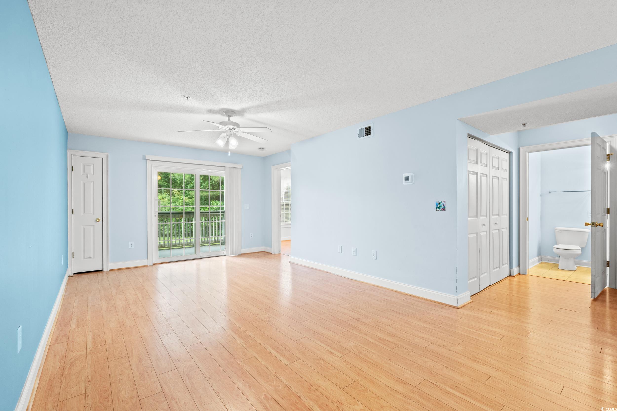 6016 Dick Pond Road, Unit 109 Myrtle Beach, SC 29588 - Photo 8 of 35 Spare room featuring a ceiling fan, baseboards, li