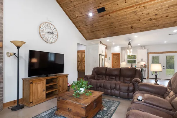 a living room with furniture and a flat screen tv