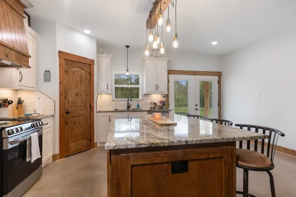 a kitchen with sink cabinets and stainless steel appliances